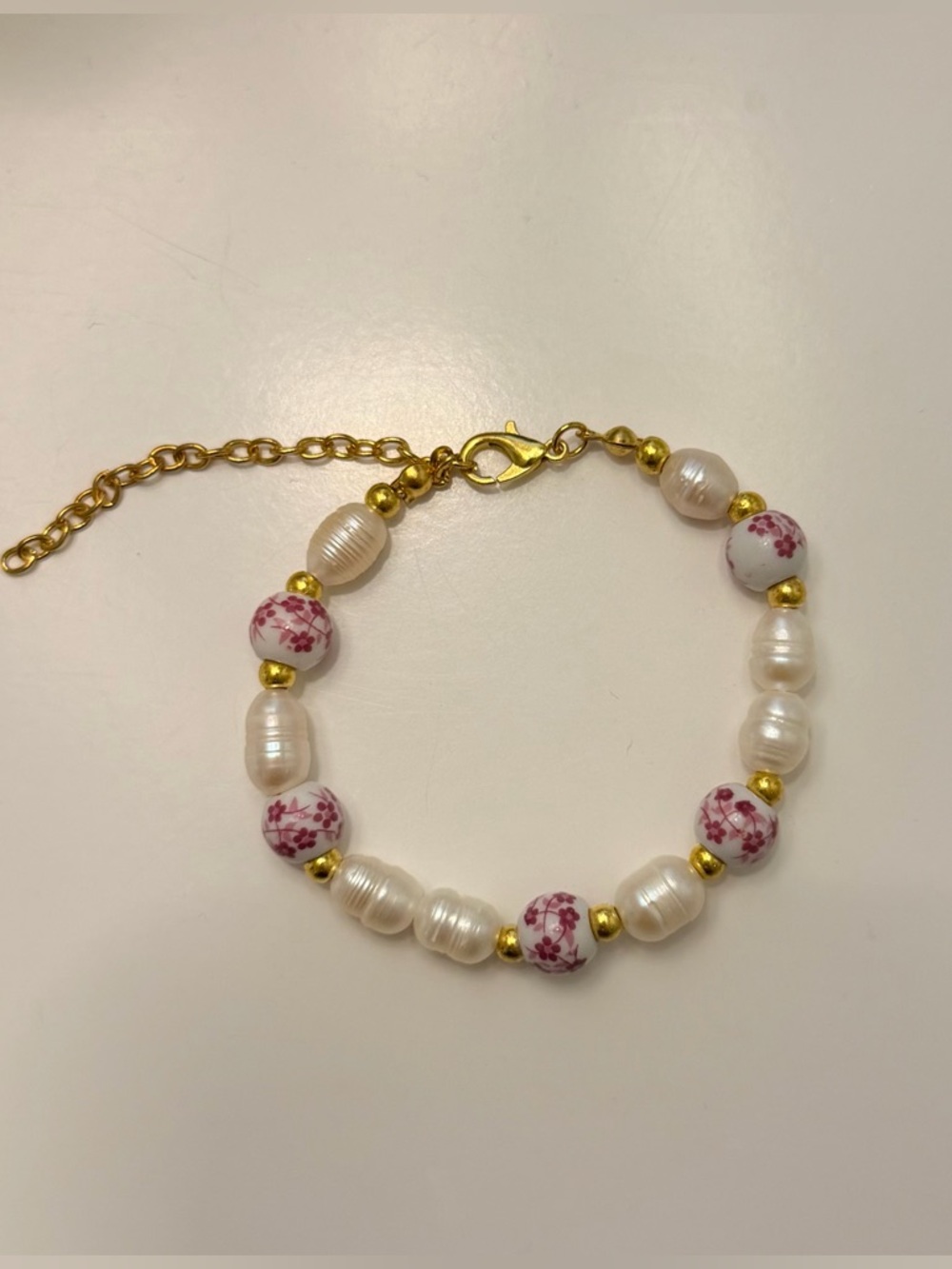 Homemade Gold-Accent Pearl Bracelet with Pink Floral Beads